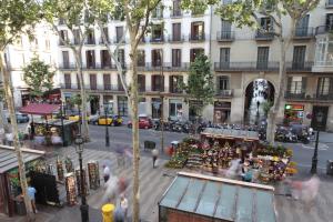 an overhead view of a city street with a christmas market at Rambla 102 in Barcelona