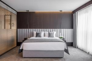 Voodi või voodid majutusasutuse Derand Hotel toas