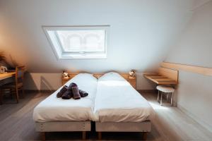 Postel nebo postele na pokoji v ubytování Hotel Brasserie De Beiaard