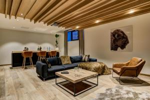 a living room with a couch and a table at Black Pearl in Chamonix-Mont-Blanc