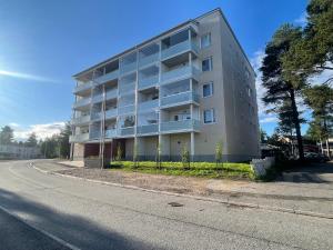 an apartment building on the side of a street at Cityhome Kaarto in Rovaniemi
