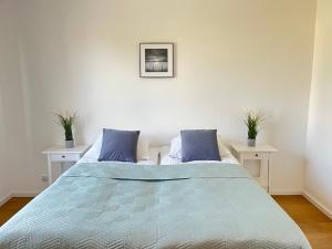 Łóżko lub łóżka w pokoju w obiekcie Apartament z ogrodem