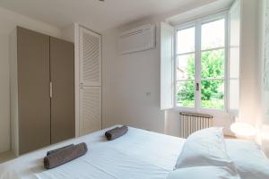 Postel nebo postele na pokoji v ubytování Giuliny Lovely Flat - The House Of Travelers