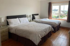 A bed or beds in a room at Quay House