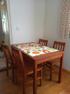a dining room table with a flower pattern on it at Leśniczówka Turowo - Podlasie 
