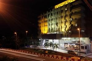 a building at night with a street in front of it at Badi'ah Hotel in Bandar Seri Begawan