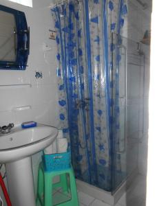 a bathroom with a sink and a shower at Meltemia Studio Samos No6 Pefkos in Votsalákia +17 photos