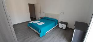 Postel nebo postele na pokoji v ubytování Fuori Ortigia room 1