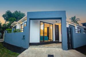 a house with an open door in front of it at The Five Residences in Galle