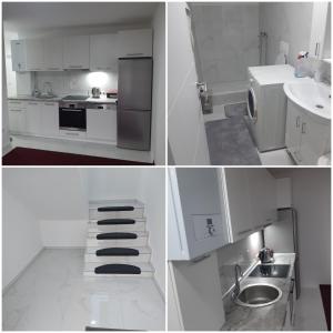 a white kitchen with a sink and a refrigerator at AQUA VET Velika Kladuša in Velika Kladuša