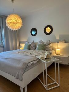 Un pat sau paturi într-o cameră la Appartement Lena