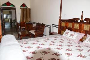 Postel nebo postele na pokoji v ubytování Hotel MSD Niwas