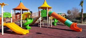 a playground with a slide in a park at Wndyham kuşadasi 1+1 teraslı 2 banyo dublex in Aydın