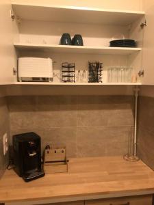 a kitchen with a counter with a coffee maker on it at Eine 2 Zimmer Ferienwohnung Münster City in Münster