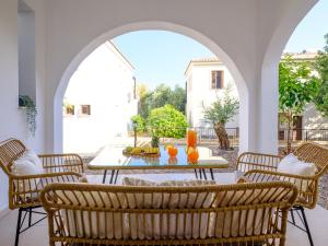 an outdoor patio with a table and chairs at Cute & Cozy Mazotos 1bed Getaway in Mazotos