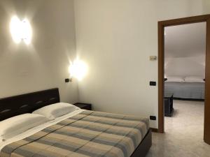 Postel nebo postele na pokoji v ubytování Hotel Kristall