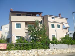 a building on the side of a street at Accomodation Suran in Rovinj