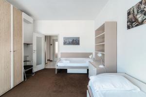 Un pat sau paturi într-o cameră la Casa Vincentina con Parcheggio Privato 6 Posti Letto