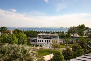 a view of a building with the ocean in the background at Recital Park Hotel in Istanbul