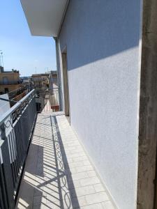 a balcony with a blue and white wall at appartamento Alleria in Laterza