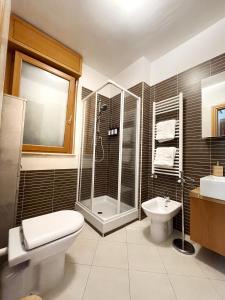 a bathroom with a shower and a toilet and a sink at Panoramic view in Rome near Vatican in Rome