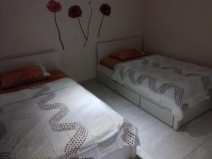 Кровать или кровати в номере platamon 3 platania
