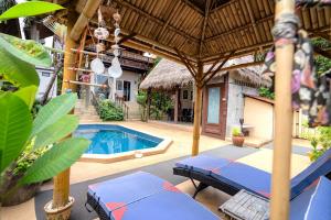 a patio with a swimming pool and a house at Villa Ayutthaya at Kantiang Bay in Ko Lanta