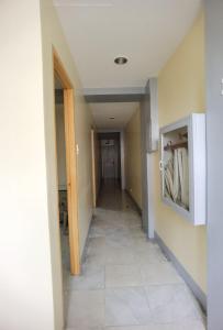 a hallway of a house with a hallwayngth at Rivoli Hotel in San Pablo