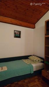 Ένα ή περισσότερα κρεβάτια σε δωμάτιο στο Family***