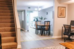 a dining room and kitchen with a table and chairs at Cozy 3-Bed Athens Getaway, Right Near UGA! in Athens