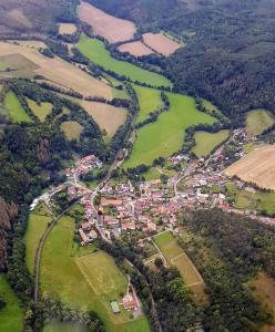 an aerial view of a town in a field at Ferienwohnung Wippertal Biesenrode in Mansfeld