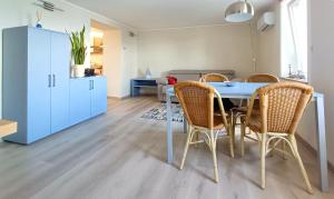 a kitchen and dining room with a table and chairs at La Romantica in Feriolo