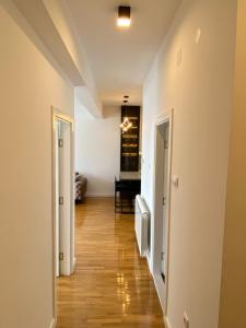 a hallway with two doors and a hard wood floor at Vista in Trebinje