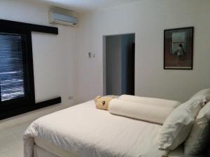 מיטה או מיטות בחדר ב-Villa Horizon Nusa Dua