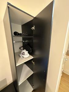 a black closet with a black door at Premium Studio Flat 05 Near Tower Bridge in London