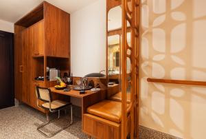 a room with a desk and a chair in a room at Brown Brenner House in Tel Aviv