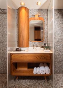 a bathroom with a sink and a mirror at Brown Brenner House in Tel Aviv