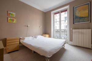 Posteľ alebo postele v izbe v ubytovaní Veeve - Peaches of Paris