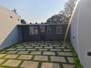 a view of a patio from the outside of a house at Pousada Calma in Maputo