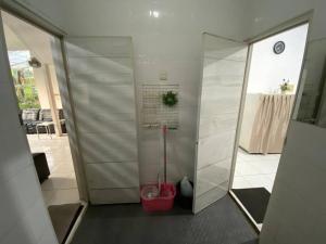 a bathroom with a shower with a toilet in it at Coral House - Near Univ Indonesia Setu Babakan in Jakarta