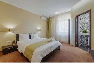 Кровать или кровати в номере Дом Отель Классик