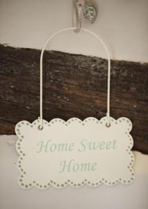 a home sweet home sign hanging on a wall at The Honeypot in Chipping Campden