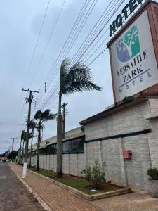 a building with a sign on the side of it at Versatile Park Hotel in Ponta Porã