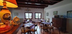 a dining room with a long table and chairs at Hotel Aglaida Apartments in Tsagarada