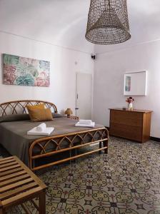 Кровать или кровати в номере Appartamento Grecale Favignana