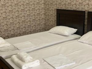 Postel nebo postele na pokoji v ubytování Hotel Mariana