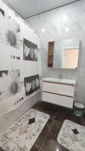 Koupelna v ubytování Люкс апартаменты в ЖК Shanyrak + 9 fotografií