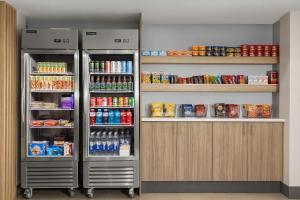 two refrigerators in a room with food and drinks at Holiday Inn Express & Suites Superior, an IHG Hotel in Superior