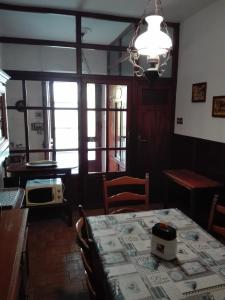 a dining room with a table and chairs and a window at Casa Graziella in Cecina