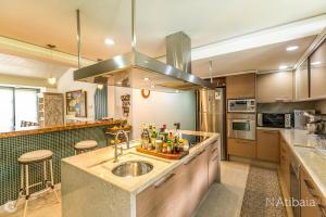 a kitchen with a sink and a stove top oven at Casa de Campo in Atibaia